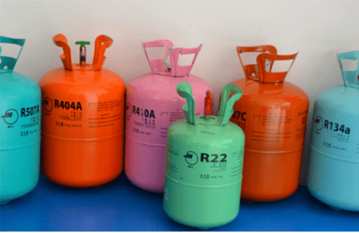 a several refrigerant bottles in different colours with refrigerant like R404A, R22, R134a